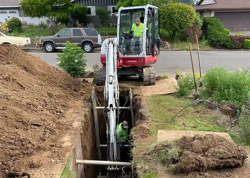 ClogPro Team Digging a Trench in Yard