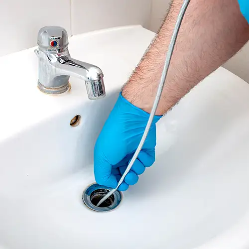 Clearing sink clogs with effective tools and techniques. Call Clog Pro Plumber for prompt drain cleaning.