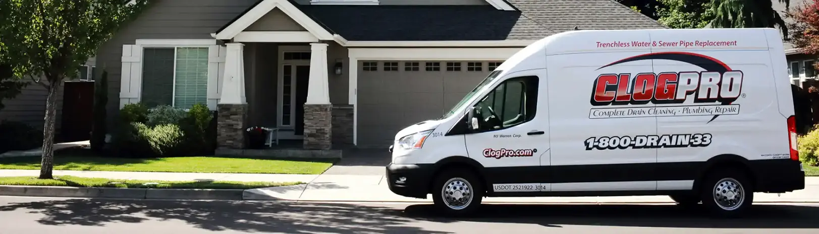 Clog Pro Truck sitting in front of a residential house. Trust Clog Pro Plumber for expert repairs.